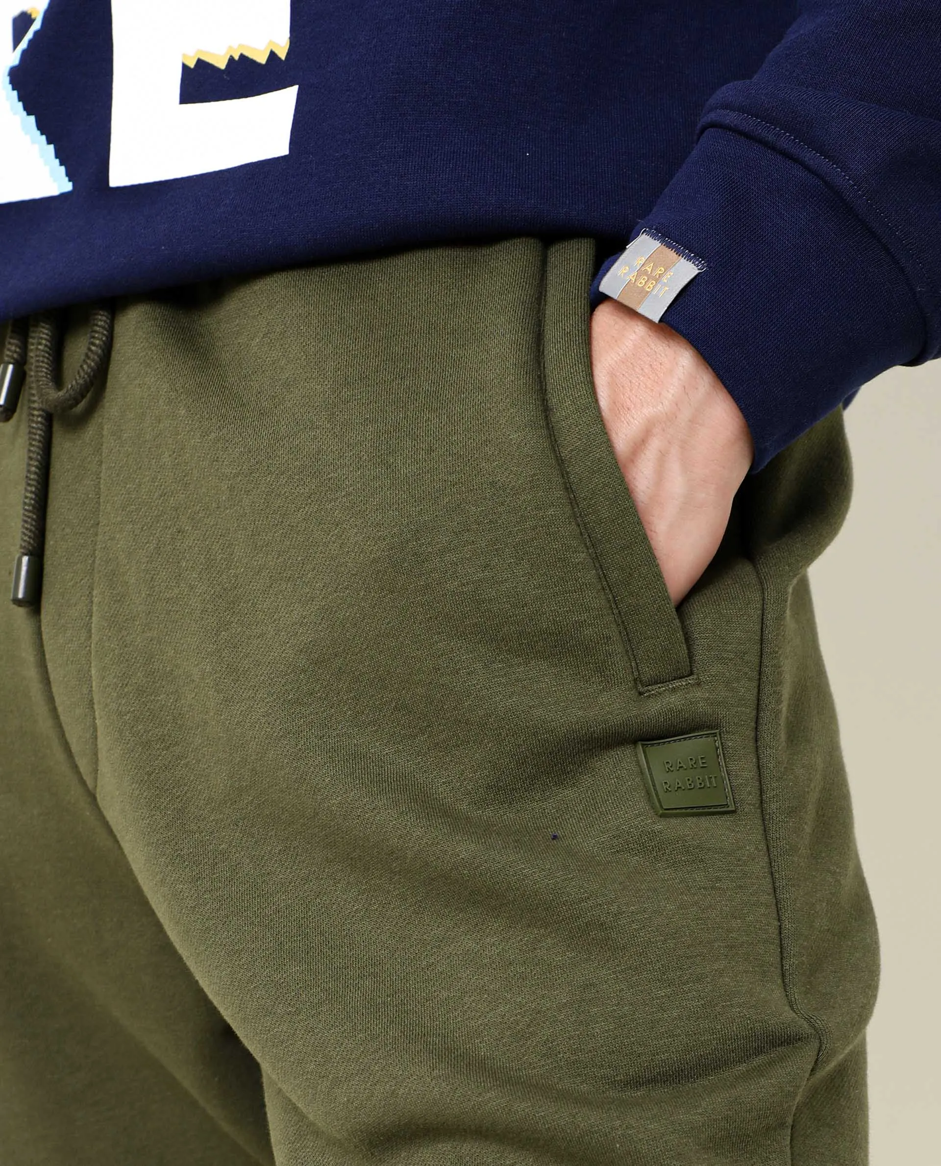 Rare Rabbit Men's Titan Light Green Cotton Polyester Fabric Relaxed Fit Mid Rise Knitted Track Pant